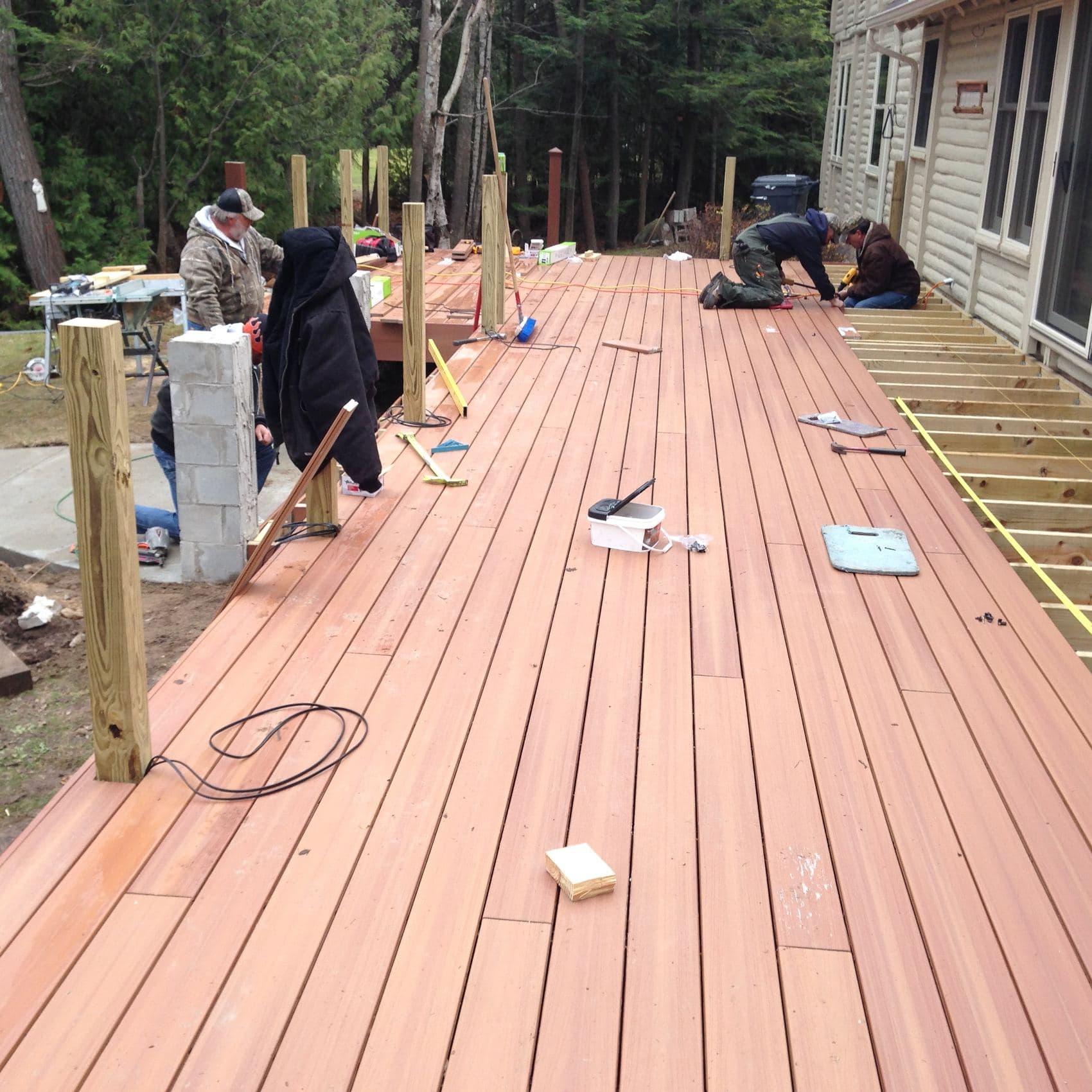 TNT Construction crew laying decking on a waterfront dock build